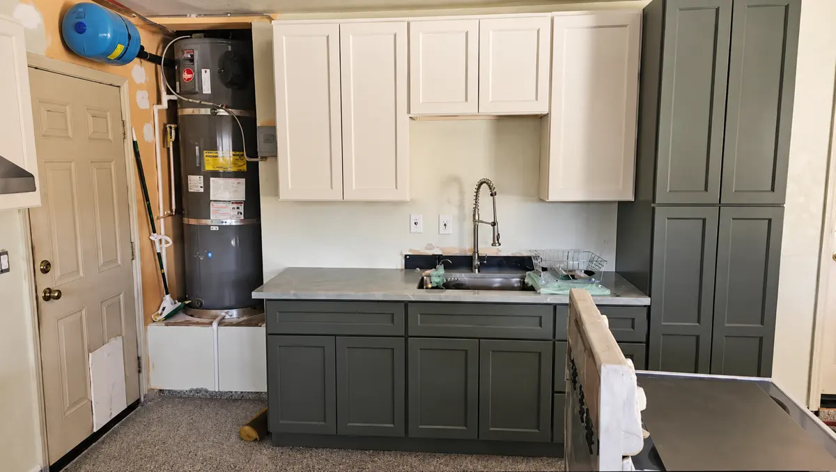 New two-tone kitchen cabinets with sink and faucet